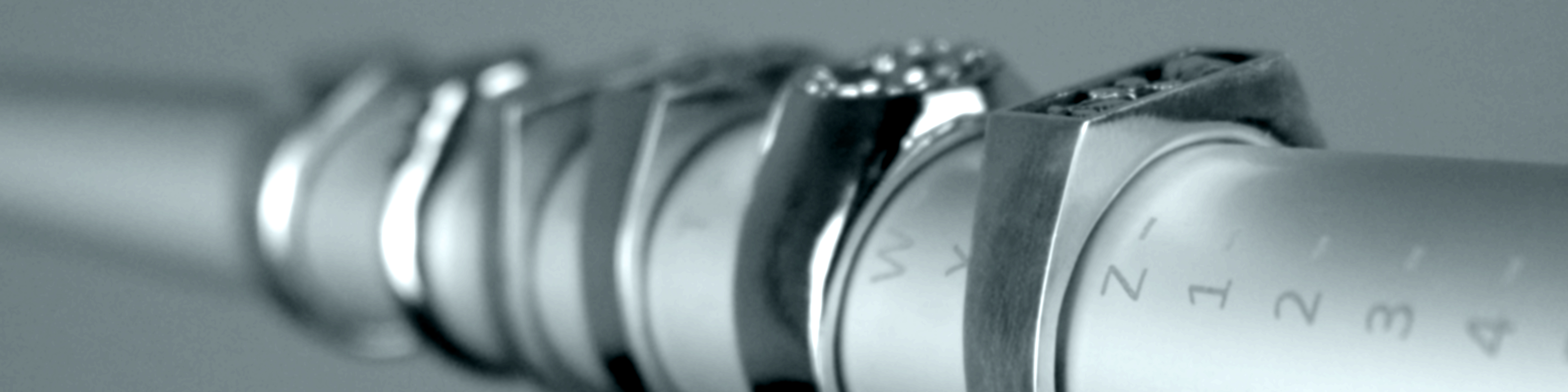 Range of Jack Sterling sterling silver signet rings stacked on a ring sizer mandrel